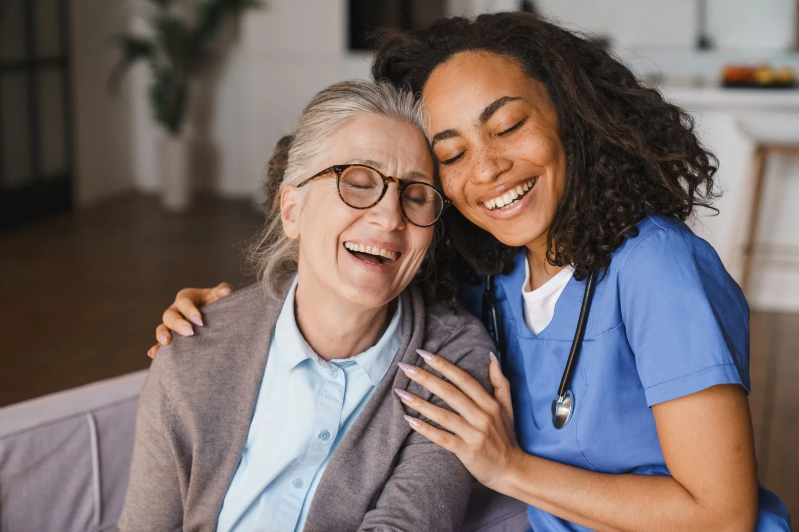 Smiling health care worker with smiling patient